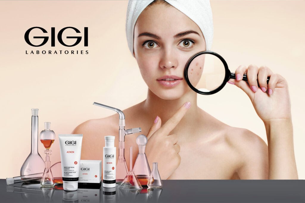Woman examining skin with magnifying glass next to GIGI Acnon skincare products for acne treatment and blemish control.