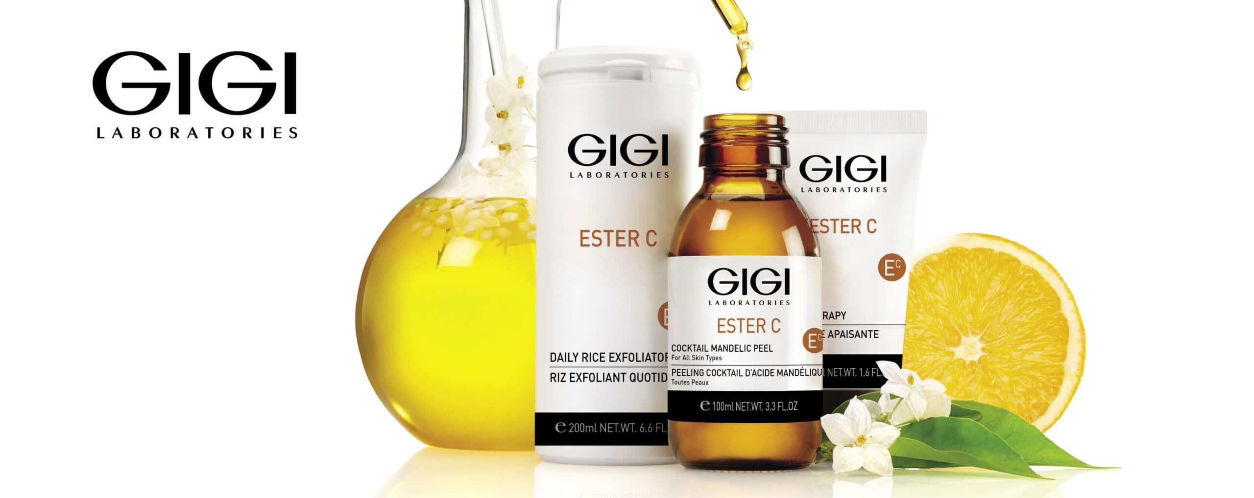 GIGI Ester C vitamin serum bottle with dropper displayed between fresh citrus fruits for brightening and antioxidant skincare banner