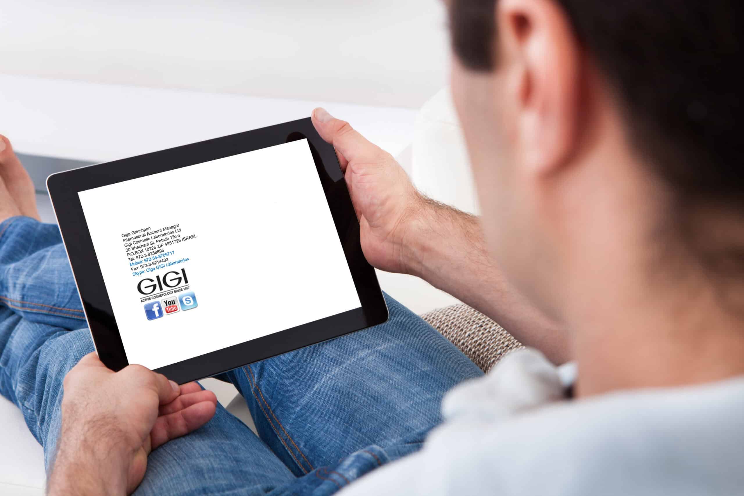 Person using tablet device for online skincare consultation, viewing digital form or appointment screen for virtual beauty assessment.